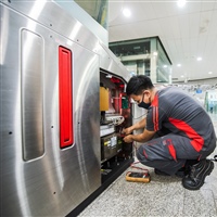 SMRT Fare System maintenance staff performing preventive maintenance 